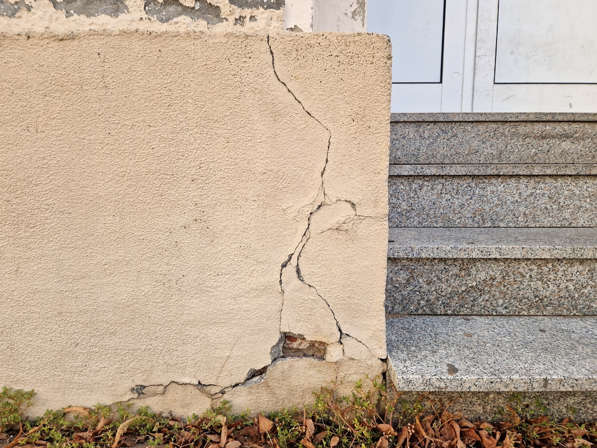 Crack at the base in the masonry of a building