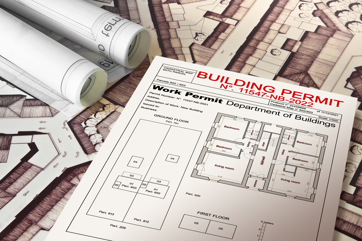 BUILDING PERMIT CONCEPT IN BUILDINGS ACTIVITY AND CONSTRUCTION INDUSTRY with residential building project, imaginary cadastral map and General Urban Plan